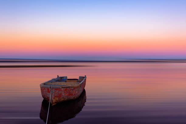 istock Fishing boat at sunrise 1035319786