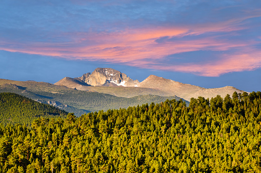 Long's Peak was named in honor of explorer Stephen Harriman Long and is featured on the Colorado state quarter. At 14,259 feet above sea level, the mountain can be seen from a wide area. This photograph of Long's Peak at sunrise was taken from Trail Ridge Road in Rocky Mountain National Park, Colorado, USA.