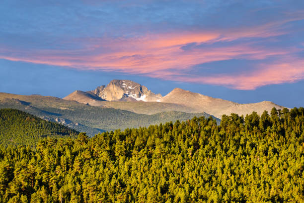 Long's Peak at Sunrise Long's Peak was named in honor of explorer Stephen Harriman Long and is featured on the Colorado state quarter. At 14,259 feet above sea level, the mountain can be seen from a wide area. This photograph of Long's Peak at sunrise was taken from Trail Ridge Road in Rocky Mountain National Park, Colorado, USA. rocky mountain national park stock pictures, royalty-free photos & images