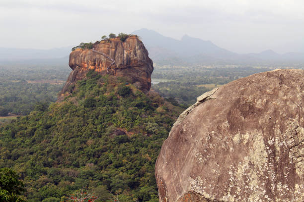 istock Rocks and Sigiriya - The Lion Rock-, as seen from Pidurangala Rock. 1035339072