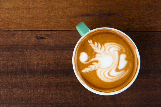 istock latte with wood background 1035342322