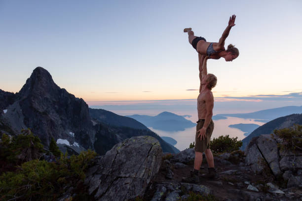 istock Acro Yoga on top of a Mountain 1035347708