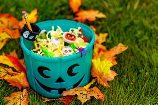 Halloween teal basket full of non-food treats