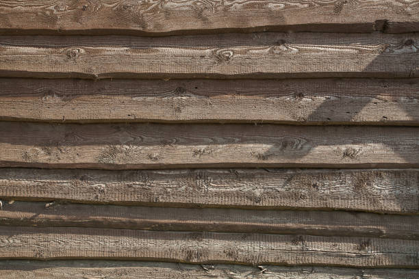 istock Old fence of rough boards 1035361122
