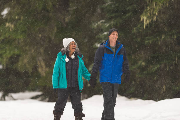 istock A senior couple snowshoeing in the forest 1035362524