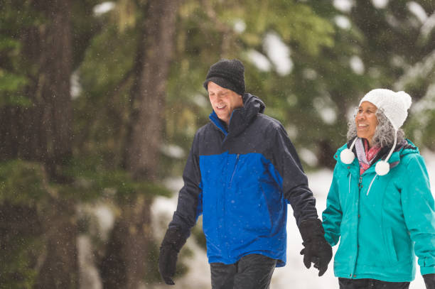 istock A senior couple snowshoeing in the forest 1035362540