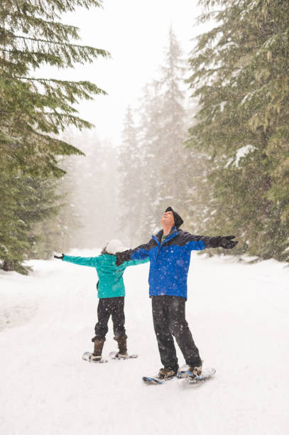 istock A senior couple snowshoeing in the forest 1035362546