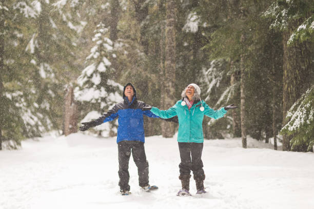 istock A senior couple snowshoeing in the forest 1035362548
