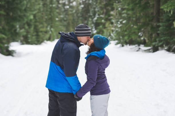 istock Millennial couple snowshoeing in the forest 1035362552