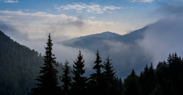 istock Mountain scenery in the Transylvanian Alps in autumn, with mist clouds 1035362798