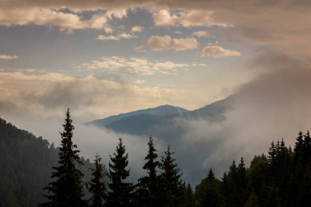istock Mountain scenery in the Transylvanian Alps in autumn, with mist clouds 1035362912