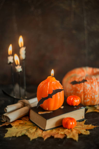 istock Postcard, Halloween background: pumpkins, candles, bats on dark background 1035365204