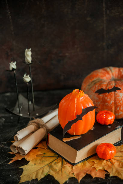 istock Postcard, Halloween background: pumpkins, candles, bats on dark background 1035365224