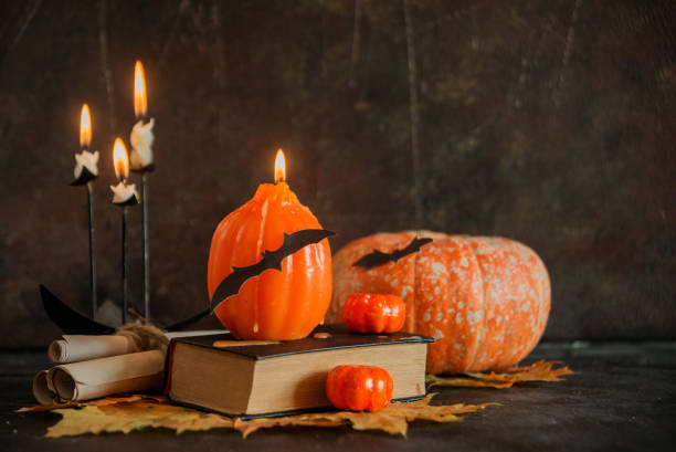 istock Postcard, Halloween background: pumpkins, candles, bats on dark background 1035365242