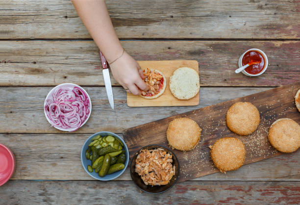 istock Burger burgers and burger ingredients on a wooden kitchen table 1035372748