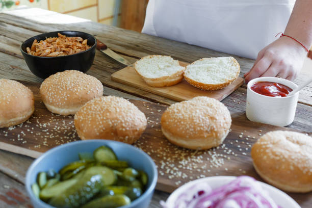 istock cooking burgers. the process of making home-burger 1035372754