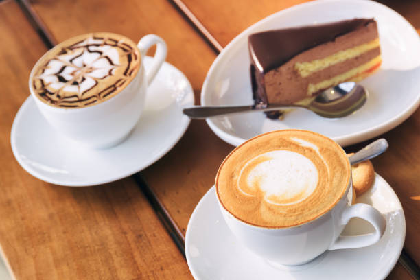 istock Cups of hot Cappuccino coffee and chocolate mousse cake 1035383668