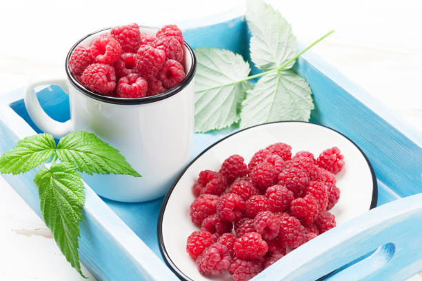 istock Cup of ripe raspberries 1035386978
