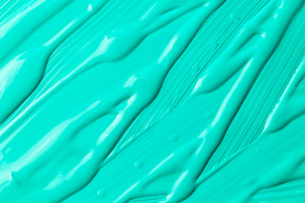 istock Liquid aquamarine paint background texture. Top view. Copy space 1035387684