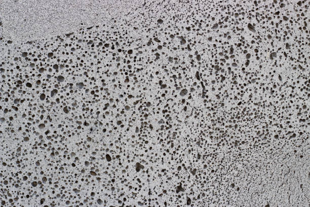 istock dark gray foam concrete close-up, texture, background, material with copy space. 1035393656