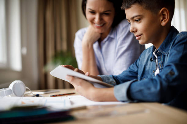 istock Teenager using digital tablet for homework 1035393818