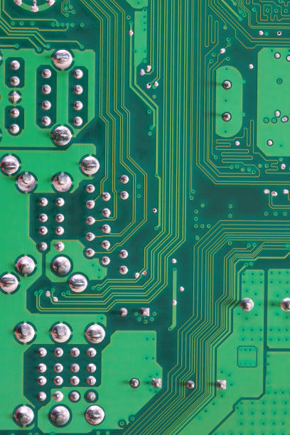 istock Green Computer motherboard surface of technology background. 1035394470