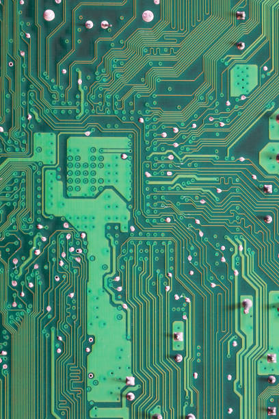 istock Green Computer motherboard surface of technology background. 1035394566