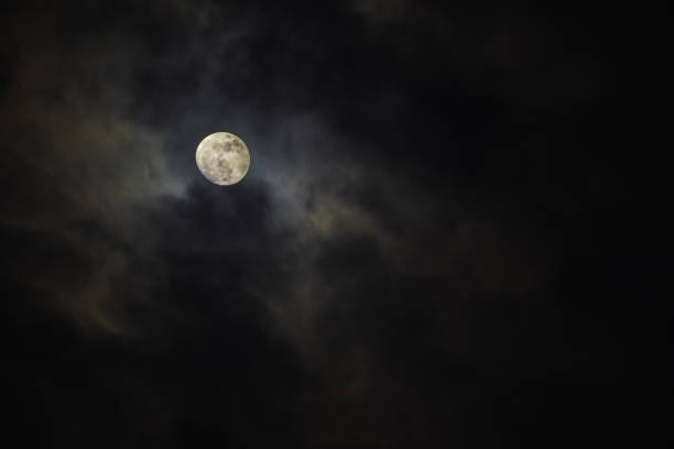istock Full moon in the middle of clouds 1035397466