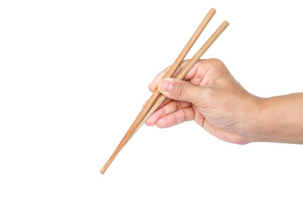 istock hand holding chopsticks tradition chinese japanese on white background 1035397712