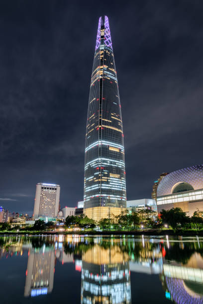 istock Skyscraper and other modern buildings reflected in lake, Seoul 1035400886
