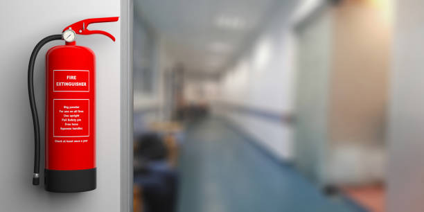 istock Fire extinguisher on a wall, blur hospital corridor background. 3d illustration 1035403298