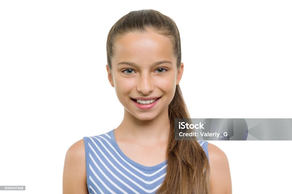 Portrait of beautiful girl of 10, 11 years old. Child with perfect white smile, isolated on white background Portrait of beautiful girl of 10, 11 years old. Child with perfect white smile, isolated on white background. Teenage Girls Stock Photo