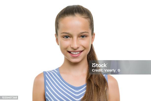 Portrait Of Beautiful Girl Of 10 11 Years Old Child With Perfect White Smile Isolated On White Background Stock Photo - Download Image Now