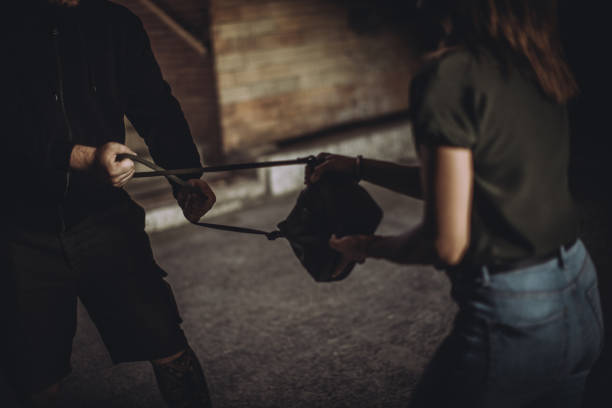 istock Woman struggles with a thief 1035407436
