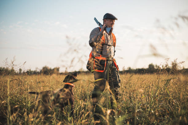 istock Hunter with hunting dog during a hunt 1035410718