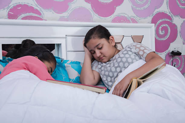 istock Two children sleeping in bed - Stock image 1035421356