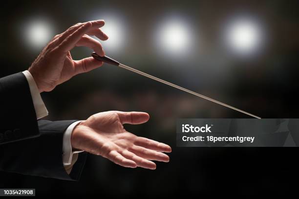Conductor Conducting An Orchestra Stock Photo - Download Image Now - Musical Conductor, Classical Music, Opera