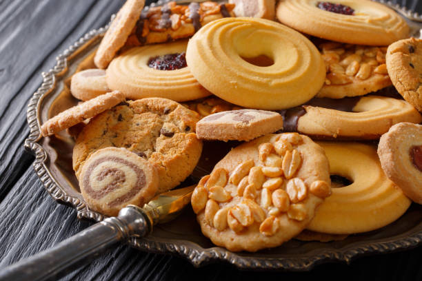 istock Mixed cookies with chocolate, jelly and nuts on the plate, horizontal 1035432674