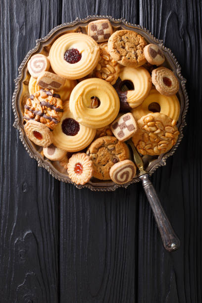 istock Festive cookie mix close-up on a plate. vertical view from above 1035439262