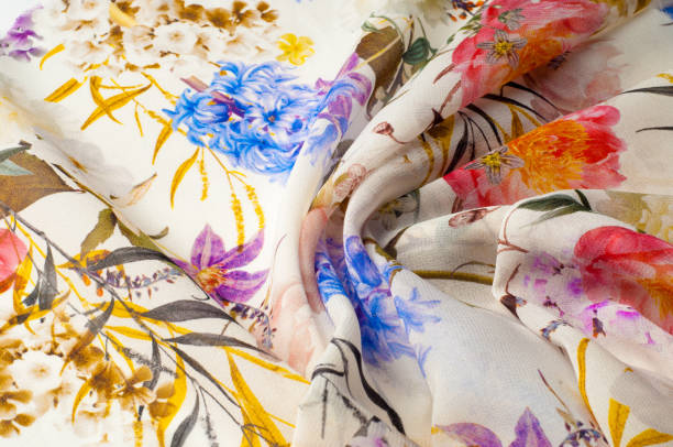 istock Texture, background, pattern. Silk fabric. Texture with pink and yellow flowers in watercolor technique. Wallpapers with roses, daisies and mimosa. Greeting card. Silk scarf, shawl. Holidays. 1035440156