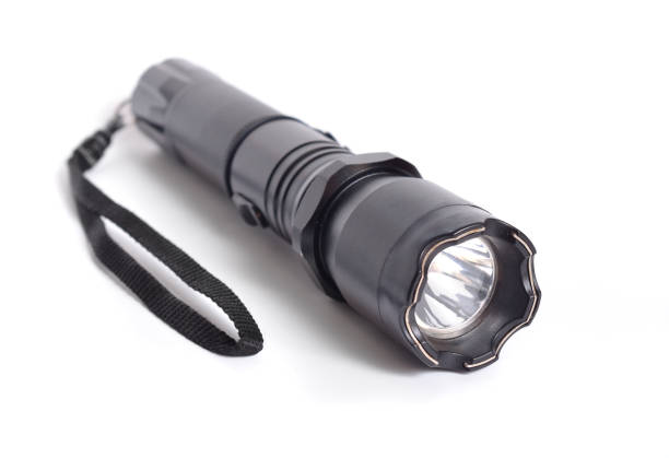 istock Shocker, Taser, Means of self-defense. Flashlight tazer isolated on white background. 1035442644