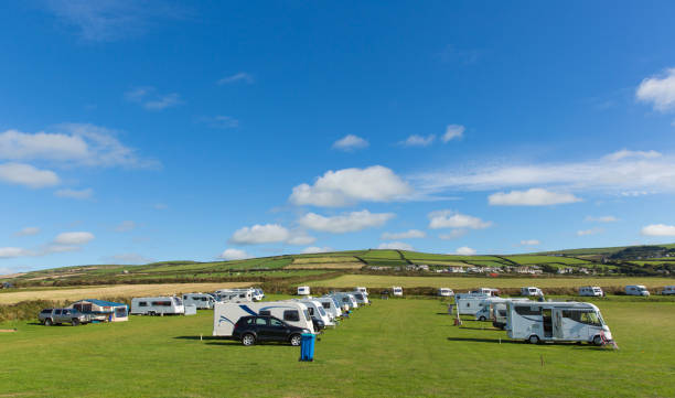 istock Motorhomes and campervans parked on a camping site with blue sky 1035443440