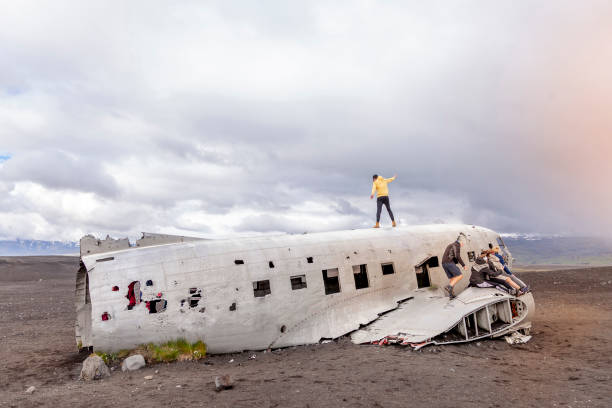 istock group of friends having fun over a plane 1035443784