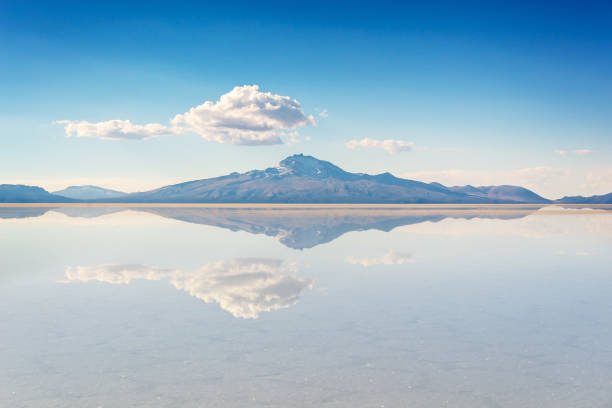 Miror effect and reflection of mountain in Salar de Uyuni (Uyuni salt flats), Potosi, Bolivia, South America stock photo
