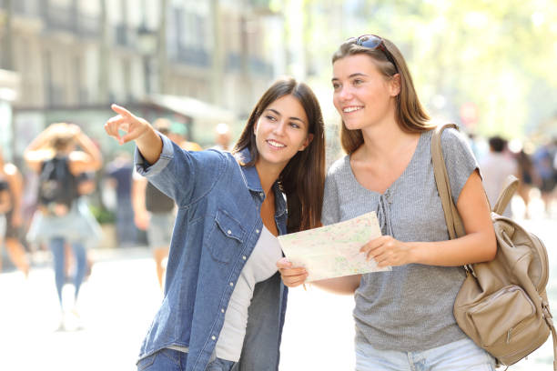 istock Girl helping to a tourist who asks direction 1035452056