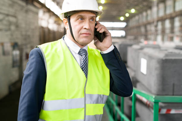 istock Mature Businessman Speaking by Phone 1035455846