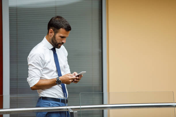 istock Young businessman typing text message indoors 1035462488