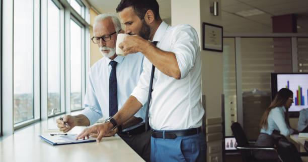 istock Working with experienced manager in the office 1035462858