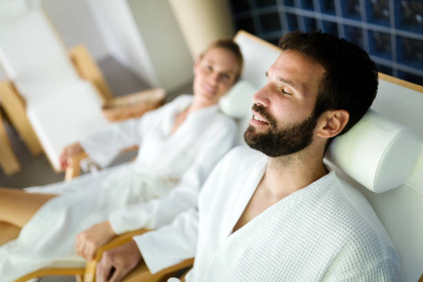 istock Attractive happy couple relaxing in spa center 1035474030