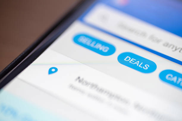 istock Deals button icon on shopping app on smartphone screen closeup 1035487182